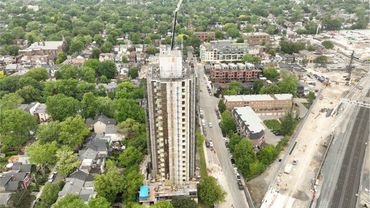 Aerial view of 444 Logan Ave in Toronto during the PrimeWall deep energy retrofit and prefabricated panel installation.